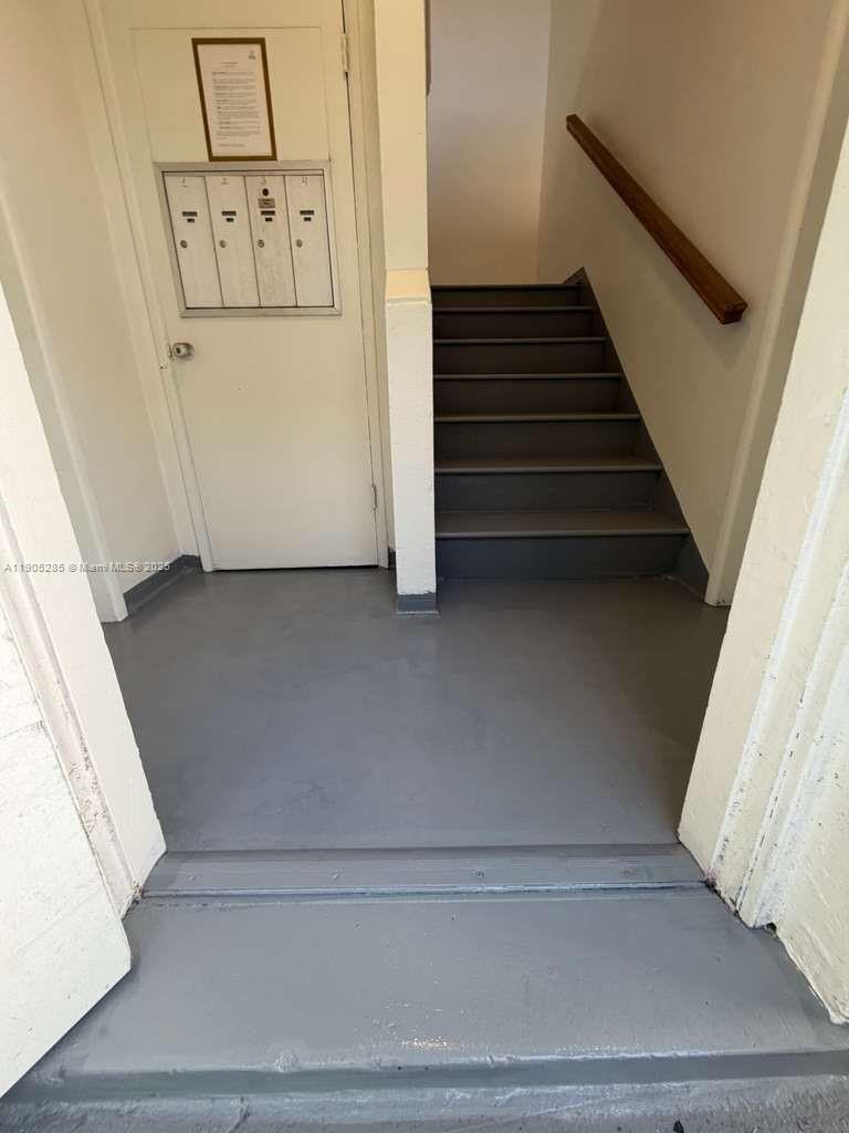 9025 Harding Avenue, Unit 1 Surfside, FL 33154 - Photo 25 of 25 a view of staircase with white walls