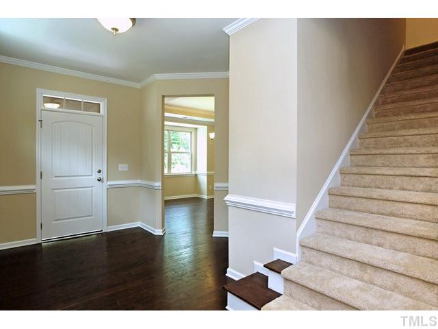 2426 Pilsley Road Apex, NC 27539 - Photo 3 of 25 a view of entryway and hall with wooden floor