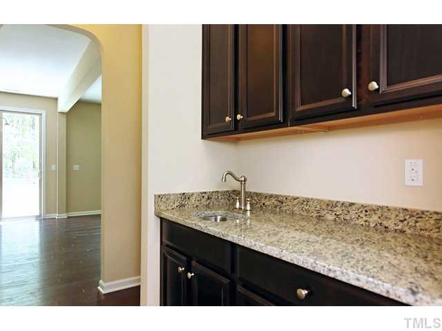 2426 Pilsley Road Apex, NC 27539 - Photo 5 of 25 a kitchen with sink and cabinets