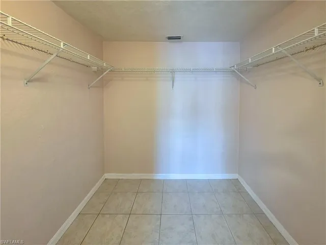 a view of a room with shelf on the wall