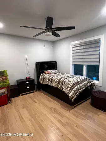 a bedroom with a bed and a table