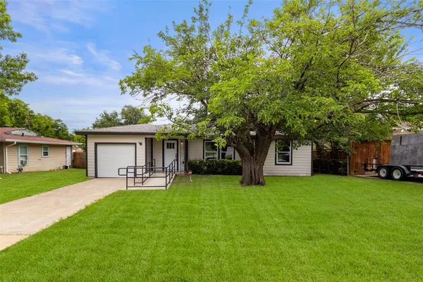 a view of a house with a yard porch and sitting area