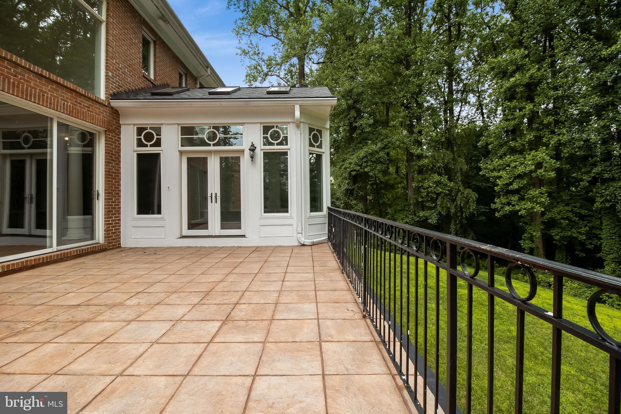 9101 Burdette Road Bethesda, MD 20817 - Photo 34 of 113 patio opposite view showing sunroom
