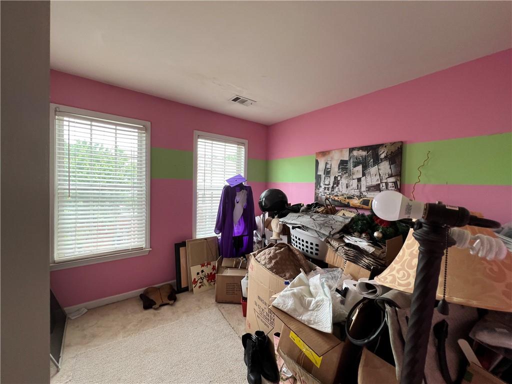 3914 Howell Park Road Duluth, GA 30096 - Photo 18 of 33 a room with furniture and a window