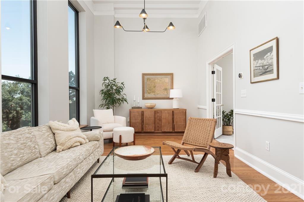 127 North Tryon Street, Unit 416 Charlotte, NC 28246 - Photo 12 of 24 a living room with furniture and a potted plant
