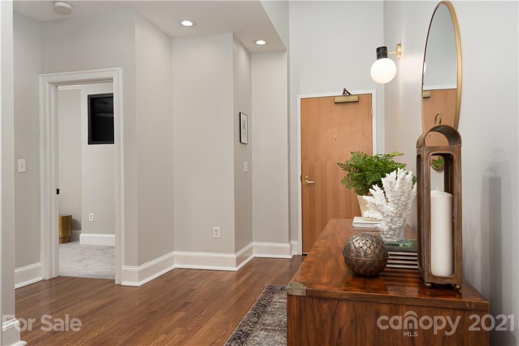 127 North Tryon Street, Unit 416 Charlotte, NC 28246 - Photo 3 of 24 a view of living room with furniture and flowers