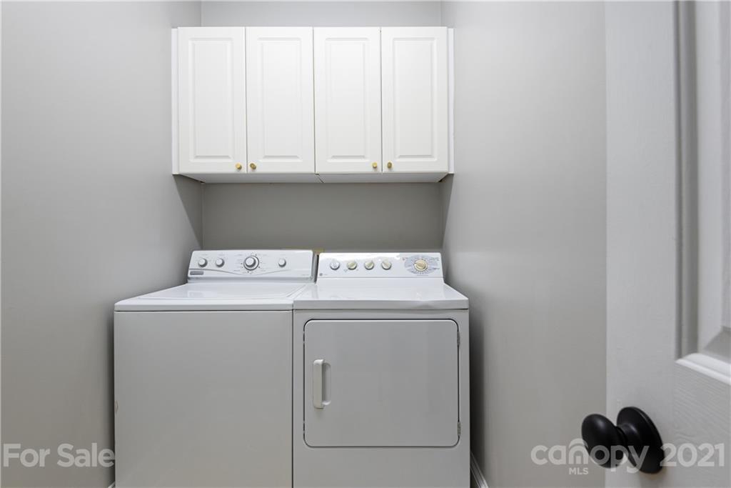 127 North Tryon Street, Unit 416 Charlotte, NC 28246 - Photo 21 of 24 a utility room with dryer and washer