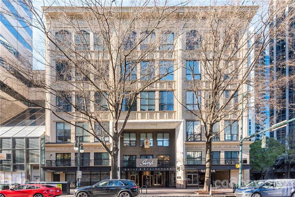 127 North Tryon Street, Unit 416 Charlotte, NC 28246 - Photo 22 of 24 a front view of a building with lot of trees