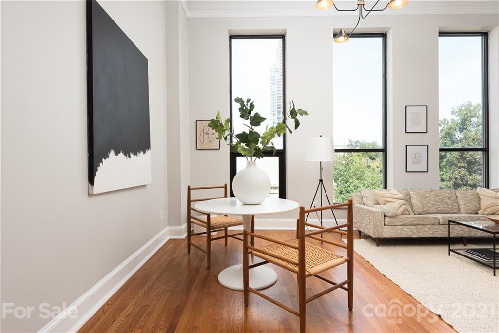 127 North Tryon Street, Unit 416 Charlotte, NC 28246 - Photo 8 of 24 a living room with furniture and a potted plant