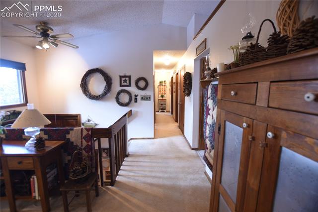1161 Pine Ridge Road Woodland Park, CO 80863 - Photo 5 of 40 Living Room Looking Towards Hallway.