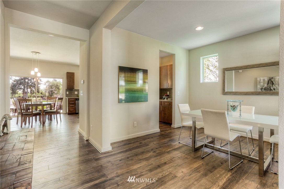 719 Southwest Langston Road Renton, WA 98057 - Photo 2 of 25 a living room with furniture and a table