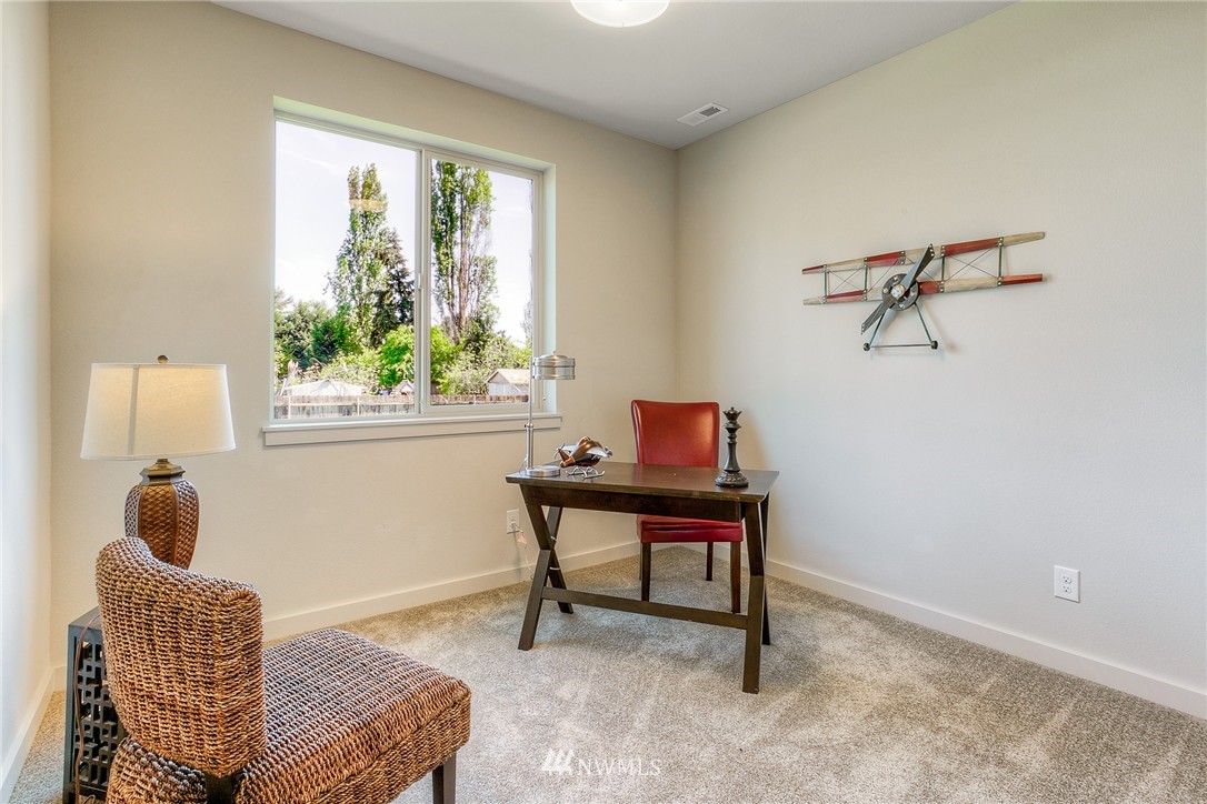 719 Southwest Langston Road Renton, WA 98057 - Photo 11 of 25 a living room with furniture and a window