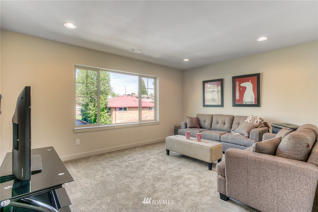 719 Southwest Langston Road Renton, WA 98057 - Photo 13 of 25 a living room with furniture and a window