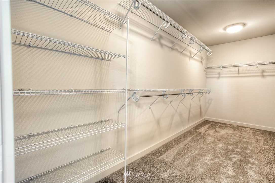 719 Southwest Langston Road Renton, WA 98057 - Photo 18 of 25 a view of walk in closet with empty racks