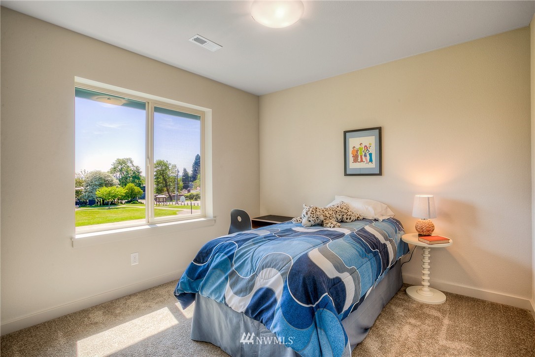 719 Southwest Langston Road Renton, WA 98057 - Photo 20 of 25 a bedroom with a bed and a window