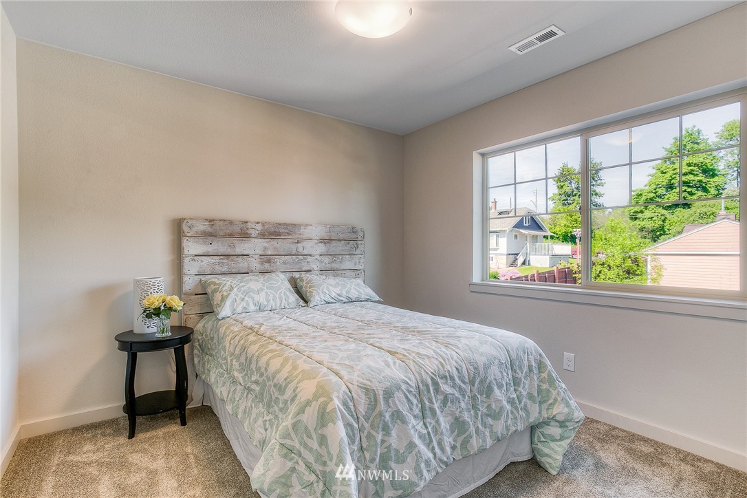 719 Southwest Langston Road Renton, WA 98057 - Photo 22 of 25 a bedroom with a bed and a window