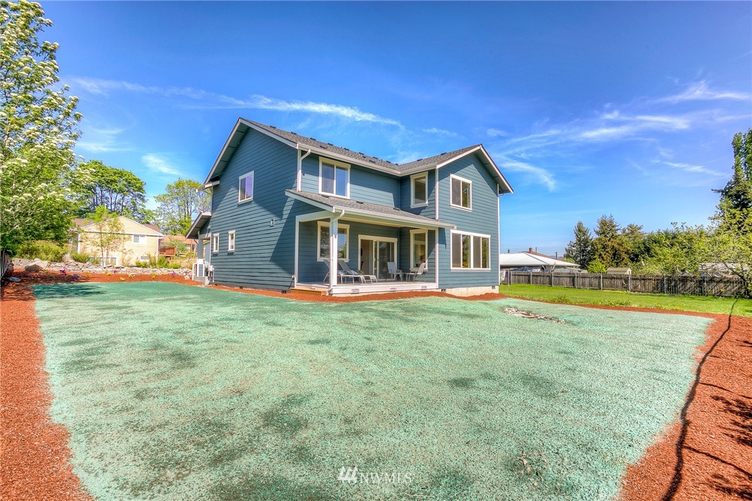 719 Southwest Langston Road Renton, WA 98057 - Photo 24 of 25 a front view of a house with a garden