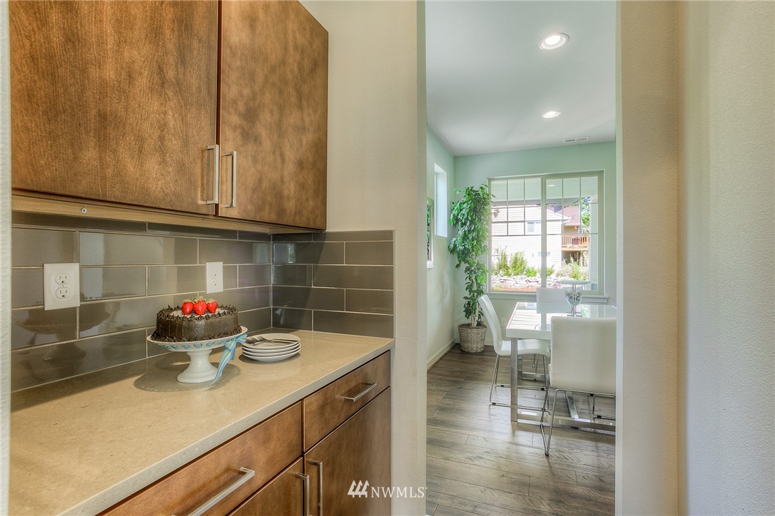 719 Southwest Langston Road Renton, WA 98057 - Photo 8 of 25 a kitchen with a sink and cabinets