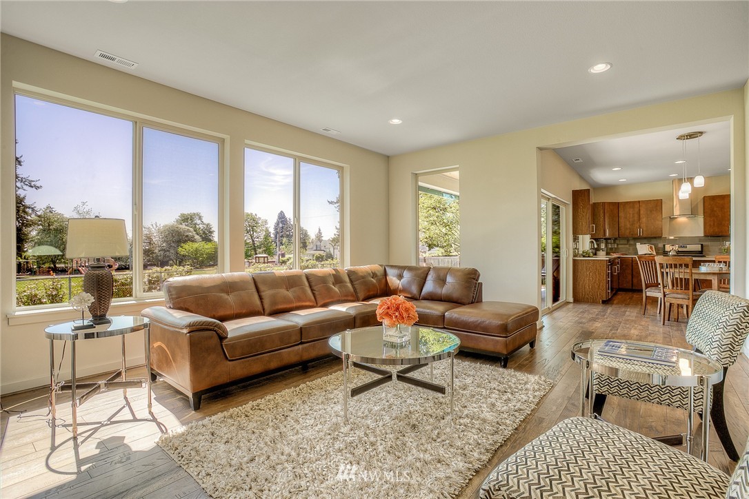 719 Southwest Langston Road Renton, WA 98057 - Photo 9 of 25 a living room with furniture and a large window