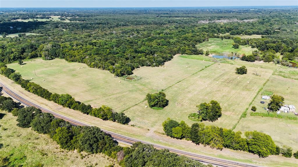 1129 Rd Chatfield Tx 75105 Road Chatfield, TX 75105 - Photo 2 of 7 an aerial view of a house with a yard