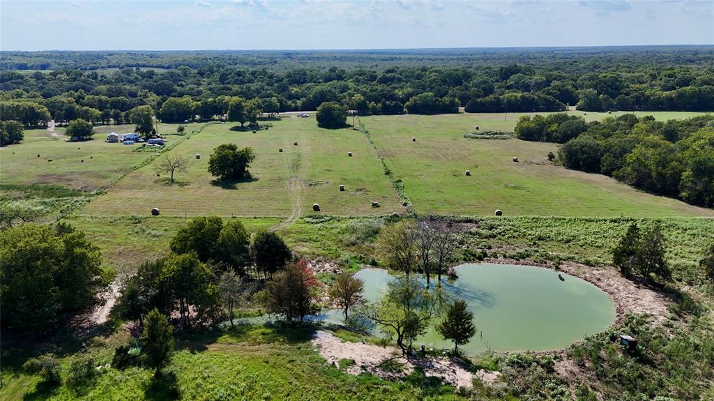 1129 Rd Chatfield Tx 75105 Road Chatfield, TX 75105 - Photo 3 of 7 an aerial view of a house with a yard and lake view