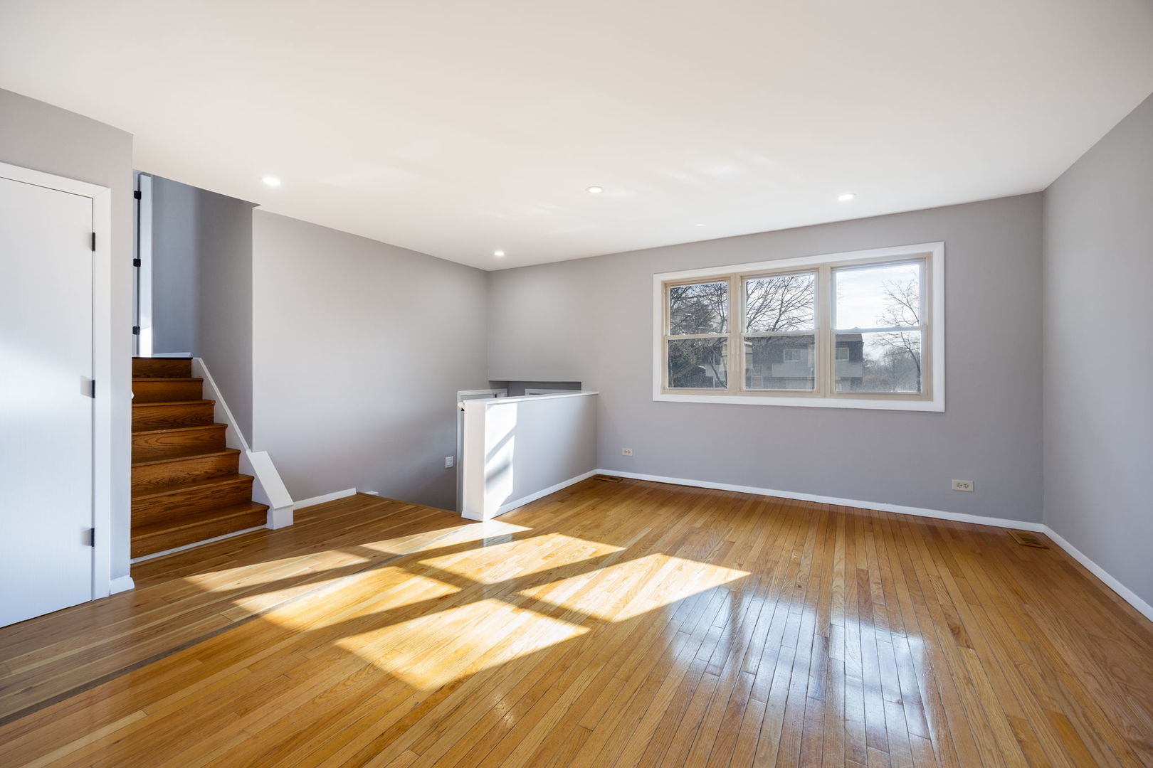 265 Cobb Circle Bolingbrook, IL 60440 - Photo 12 of 29 a view of an empty room with wooden floor and window