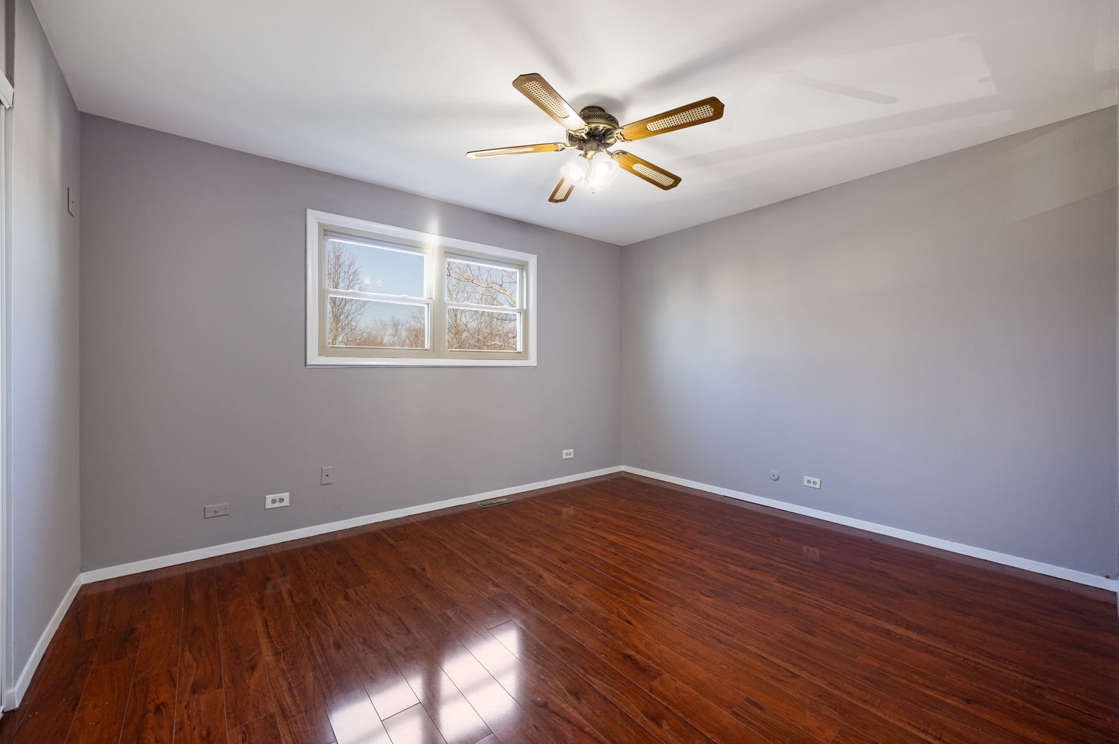265 Cobb Circle Bolingbrook, IL 60440 - Photo 15 of 29 a view of an empty room with wooden floor and a window