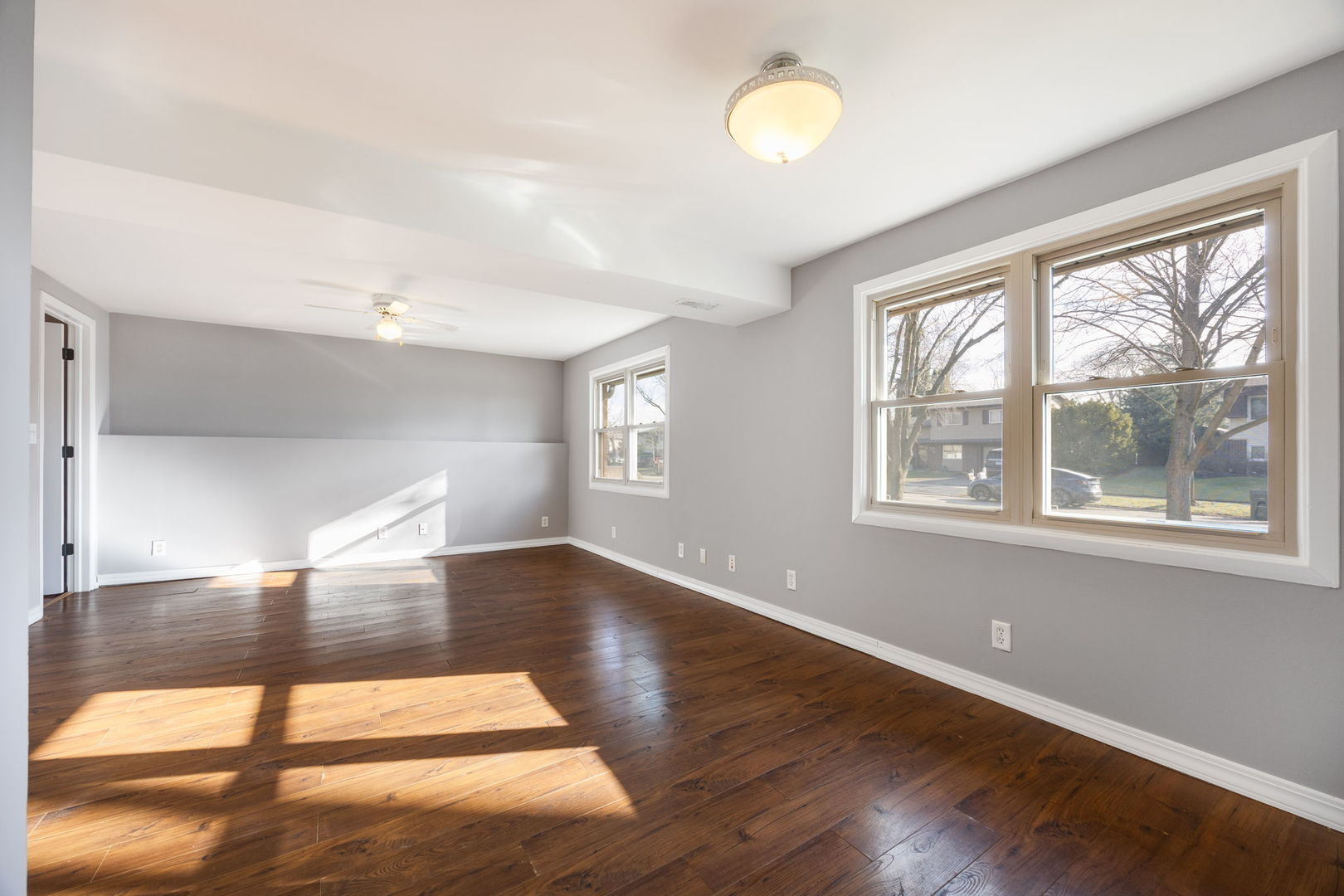 265 Cobb Circle Bolingbrook, IL 60440 - Photo 19 of 29 a view of an empty room with wooden floor and a window