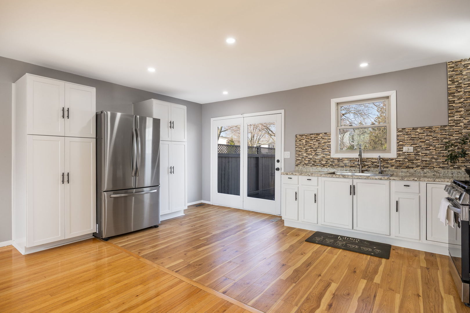 265 Cobb Circle Bolingbrook, IL 60440 - Photo 7 of 29 a kitchen with stainless steel appliances granite countertop a refrigerator and a stove top oven