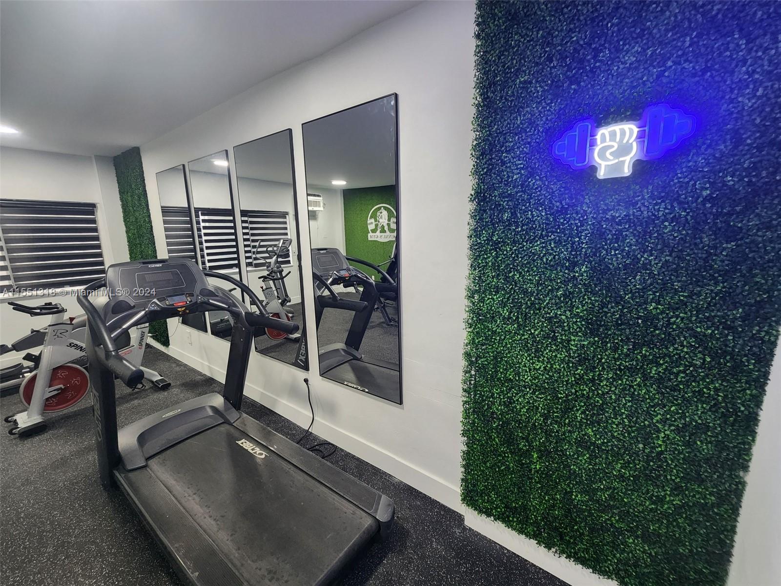 2101 Normandy Drive, Unit 204 Miami Beach, FL 33141 - Photo 27 of 30 a view of a room with gym equipment
