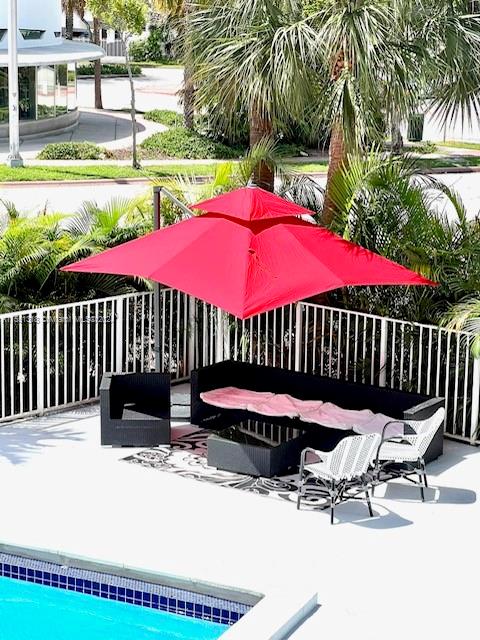 2101 Normandy Drive, Unit 204 Miami Beach, FL 33141 - Photo 4 of 30 a bench sitting in front of a building