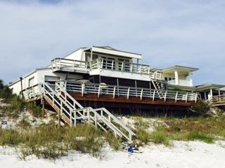 153 Pelican Cir Inlet Beach Inlet Beach, FL 32461 - Photo 1 of 4 a view of a house with swimming pool next to a lake