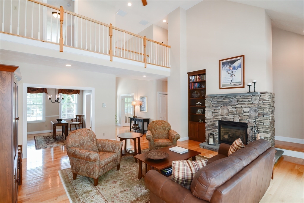 3 Freeman Place Mendon, MA 01756 - Photo 15 of 41 a living room with furniture and a fireplace