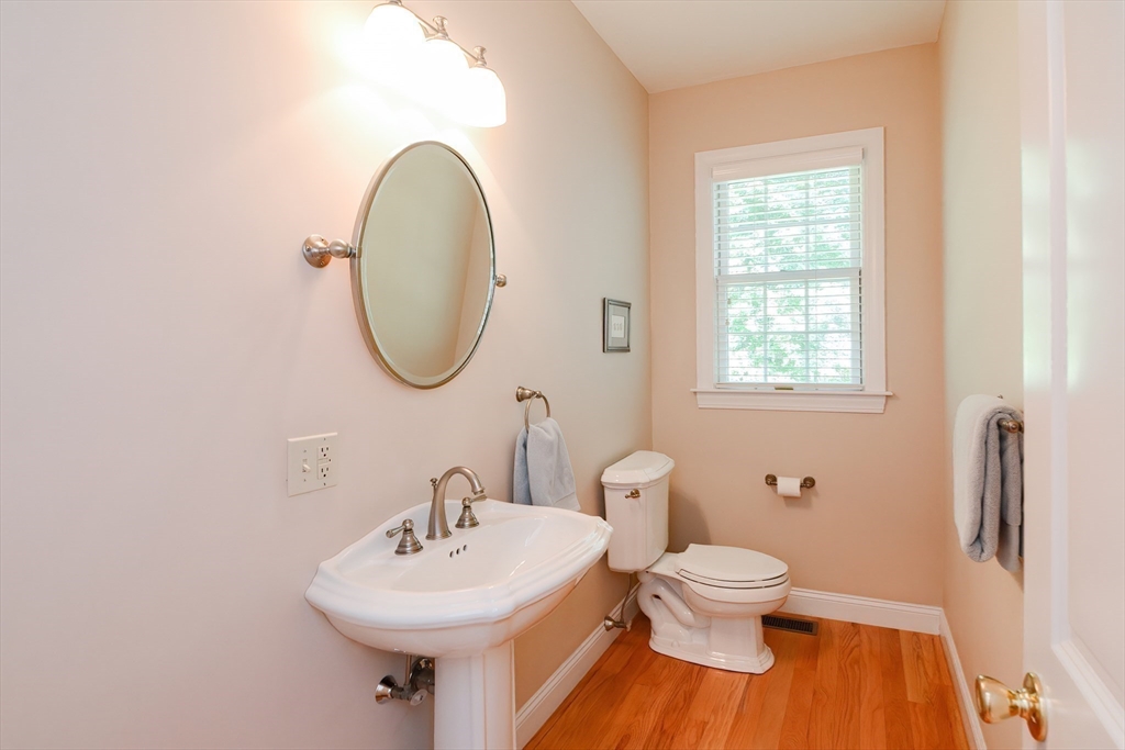 3 Freeman Place Mendon, MA 01756 - Photo 20 of 41 a bathroom with a toilet sink and mirror