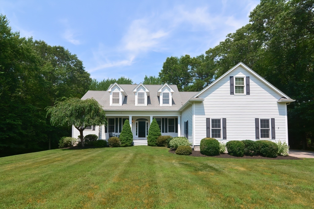 3 Freeman Place Mendon, MA 01756 - Photo 2 of 41 a front view of a house with a yard