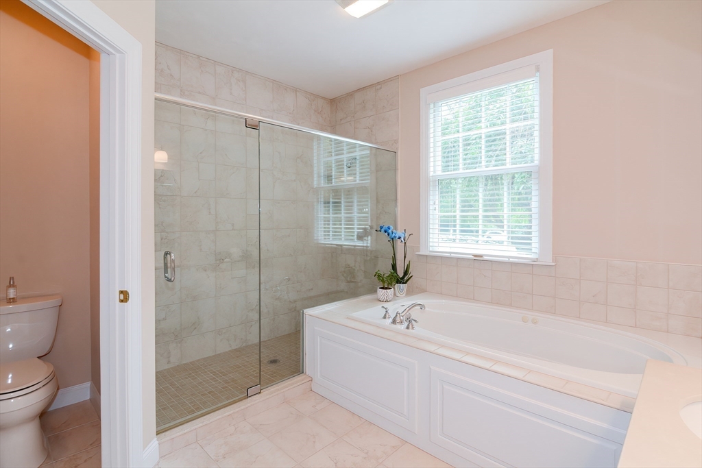 3 Freeman Place Mendon, MA 01756 - Photo 25 of 41 a white bath tub sitting next to a toilet