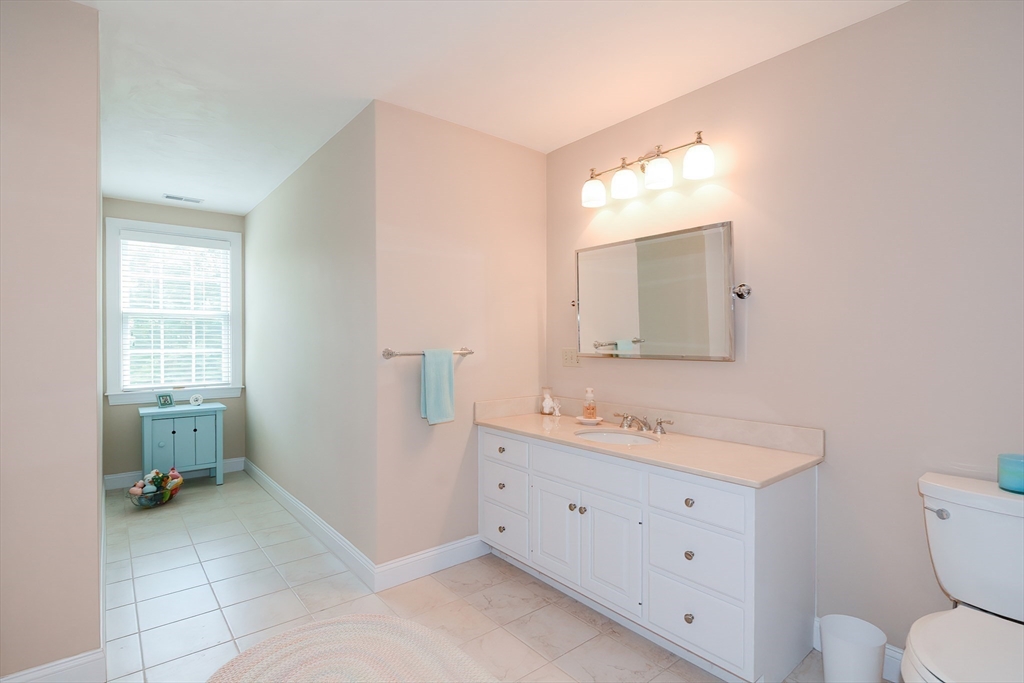 3 Freeman Place Mendon, MA 01756 - Photo 27 of 41 a bathroom with a toilet sink and mirror