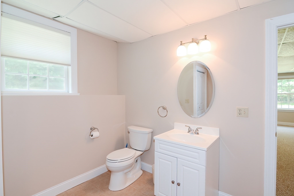 3 Freeman Place Mendon, MA 01756 - Photo 36 of 41 a bathroom with a toilet sink and mirror