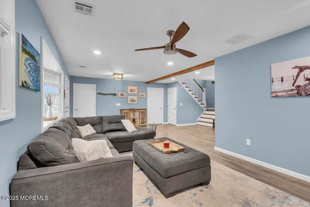 a bedroom with furniture and windows