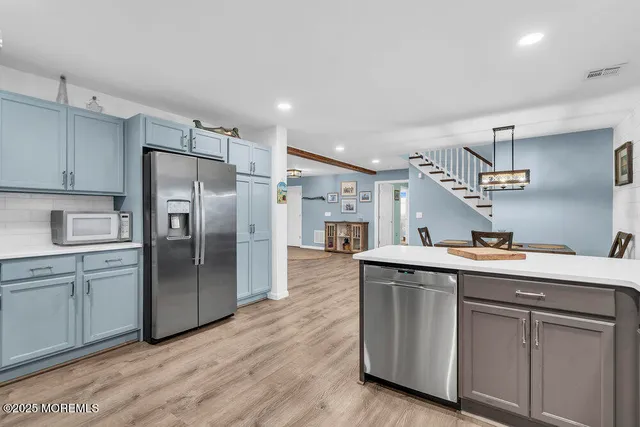 a view of washer and dryer with kitchen countertops