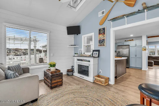 a bedroom with furniture and a flat screen tv