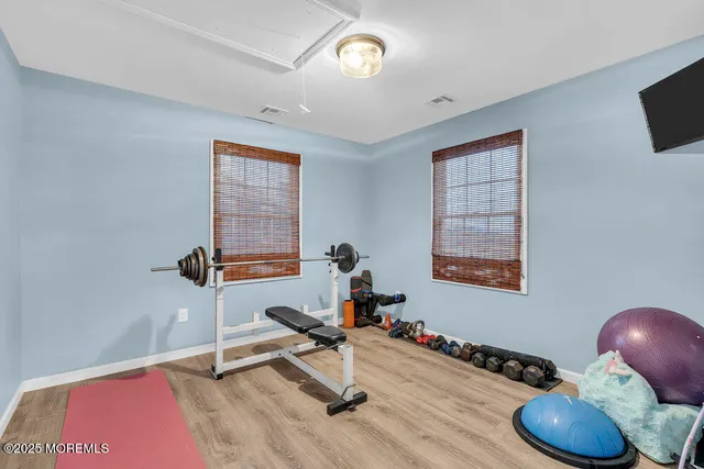 a view of walk in closet with clothes