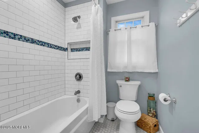 a aerial view of a house with swimming pool table and chairs
