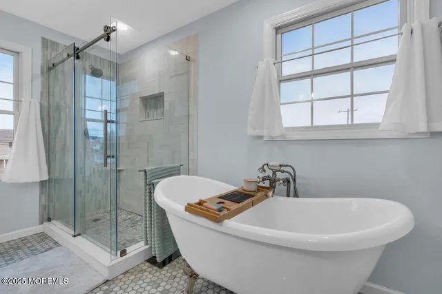 an aerial view of a house with outdoor seating