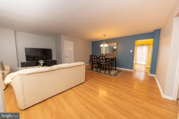 a kitchen with a refrigerator a sink and cabinets