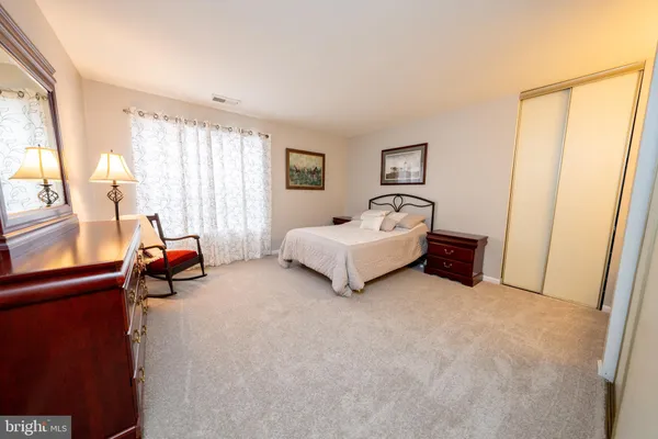 a bed room with furniture and a window