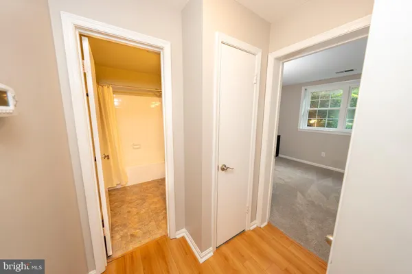 a view of a room with furniture and a rug