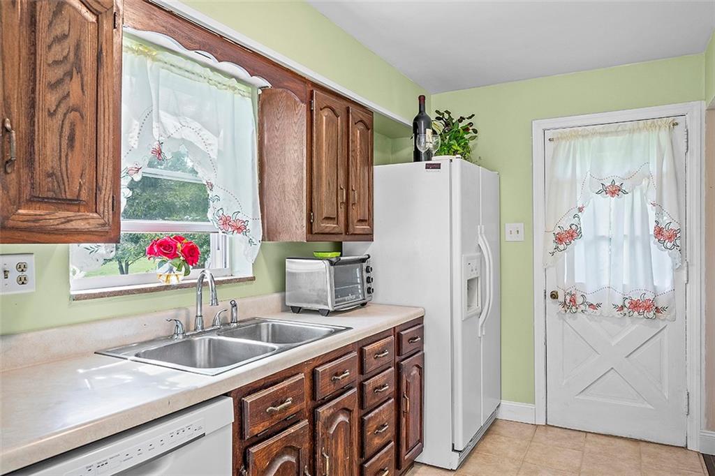 8 Ellen Drive McKees Rocks, PA 15136 - Photo 12 of 25 a bathroom with a refrigerator and a sink