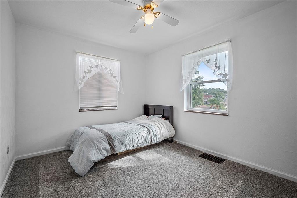 8 Ellen Drive McKees Rocks, PA 15136 - Photo 16 of 25 a bedroom with a bed and a window