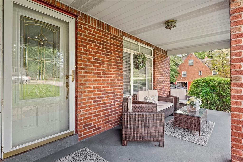 8 Ellen Drive McKees Rocks, PA 15136 - Photo 4 of 25 a outdoor living space with furniture and a potted plant